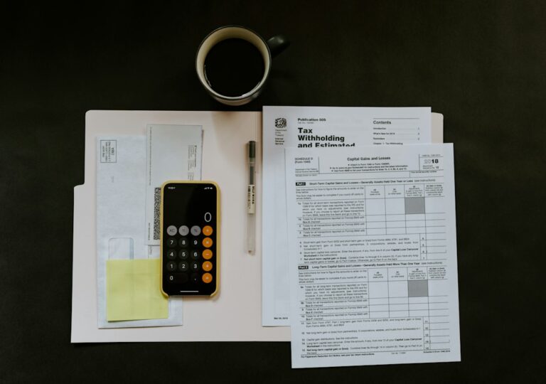 A homeowner reviews a tax notice beside folders of receipts, bank statements, and an organized tax return.